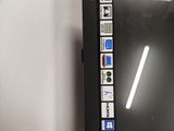 a picture of a black tablet computer on a white surface