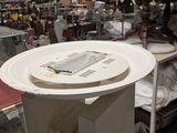 a white plate with a cell phone on top of it