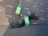 two keys that are sitting on the seat of a car