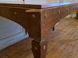 a wooden table with a metal frame on top of it