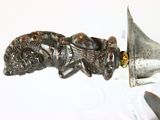 a metal object with a lion head on top of it
