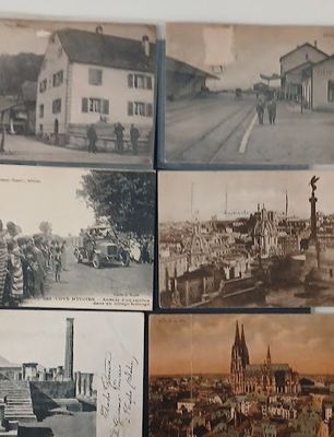 several old black and white photos of military vehicles and buildings
