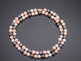 a multicolored beaded necklace with a gold clasp