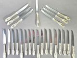 a lot of knives and knives that are on the table