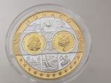 a close up of a coin in a plastic container on a table
