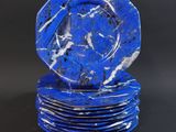 blue and white marble plates stacked on top of each other