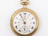 une montre de poche ancienne avec des chiffres romains sur le cadran