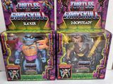 two action figures of a man in a purple shirt and a man in a black suit