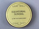 a close up of a round badge with the words equatoriial sundial