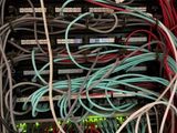 a bunch of wires and wires in a cabinet