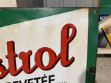 a sign that says castrol on the side of a building