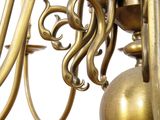 a gold colored chandelier hanging from the ceiling
