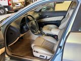a car that is sitting in the garage with its door open