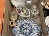 a box full of assorted items sitting on the floor