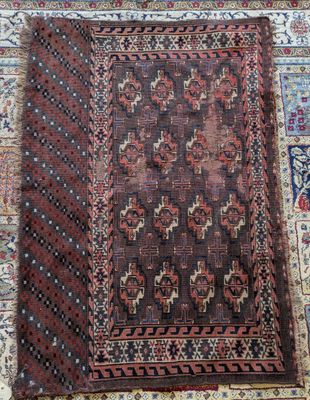 a brown and red rug with a pattern on it