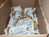 a cardboard box filled with a lot of food items
