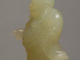 chinese carved jade figure of a person holding a glass