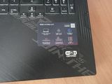 a close up of a laptop with a credit card on the keyboard