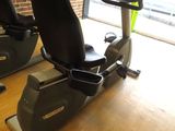 two stationary exercise bikes sitting on a wooden table