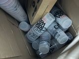 a cardboard box filled with water bottles and a bottle of soda