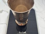 an image of a cup on a scale on a table