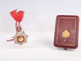 a red book and a red book with a gold star on it