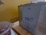 a toaster sitting on a counter next to a bowl of food