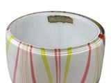 a white bowl with red and yellow stripes on it