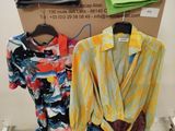 a display of clothes on a rack in a room