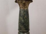 a small table with a marble top on a stand