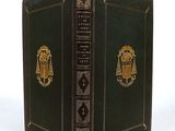 an old book with a gold lion on the cover