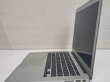 a laptop computer sitting on a table with a white background
