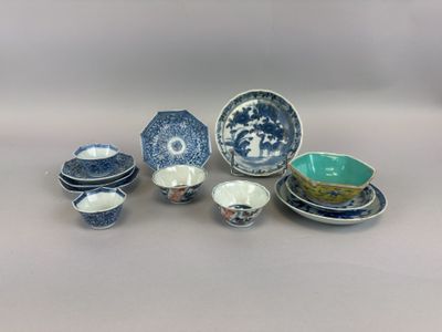 a group of blue and white dishes and bowls