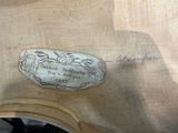 a picture of a piece of wood with writing on it