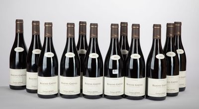 six bottles of wine lined up in a row on a table