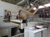 a picture of a machine that is working on a piece of wood