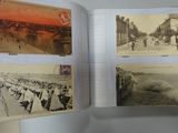 a person holding an open book with pictures on it