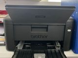 a printer that is sitting on top of a desk