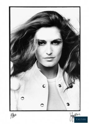 black and white photograph of a woman with long hair wearing a white jacket