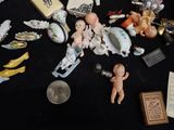 a lot of small figurines on a black table