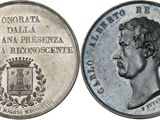 four different types of silver coins are shown in a row