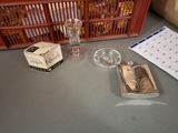 a bottle of liquor, a glass and a notepad on a table