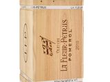 the wooden box is holding a bottle of wine and a glass of wine