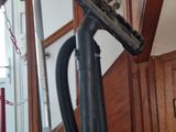 a vacuum that is sitting on the stairs of a house