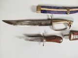 several different types of knives are displayed on a white surface