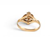 a close up of a gold ring on a white background