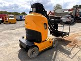 a yellow machine that is sitting in the dirt
