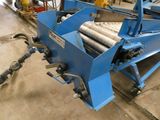 an image of a machine that is working on a piece of metal