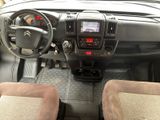 a picture of the interior of a vehicle with a steering wheel