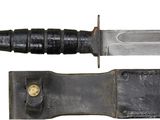 a knife that is laying on top of a knife holder
